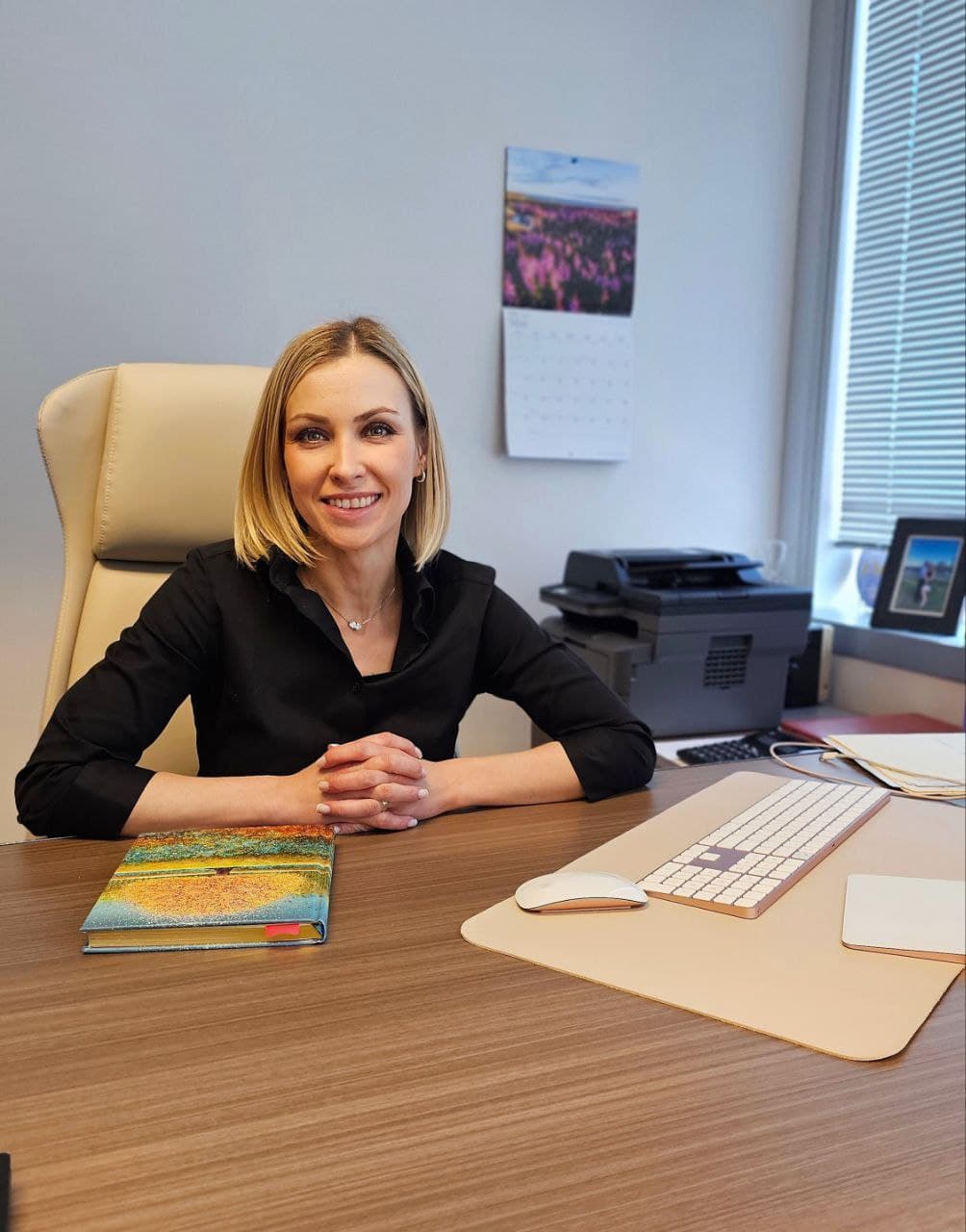 Olga Chykaluk at her desk