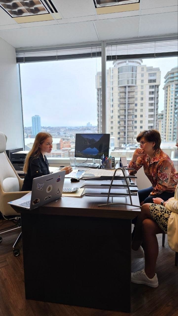 A working meeting at the Anytime Accounting office overlooking Calgary