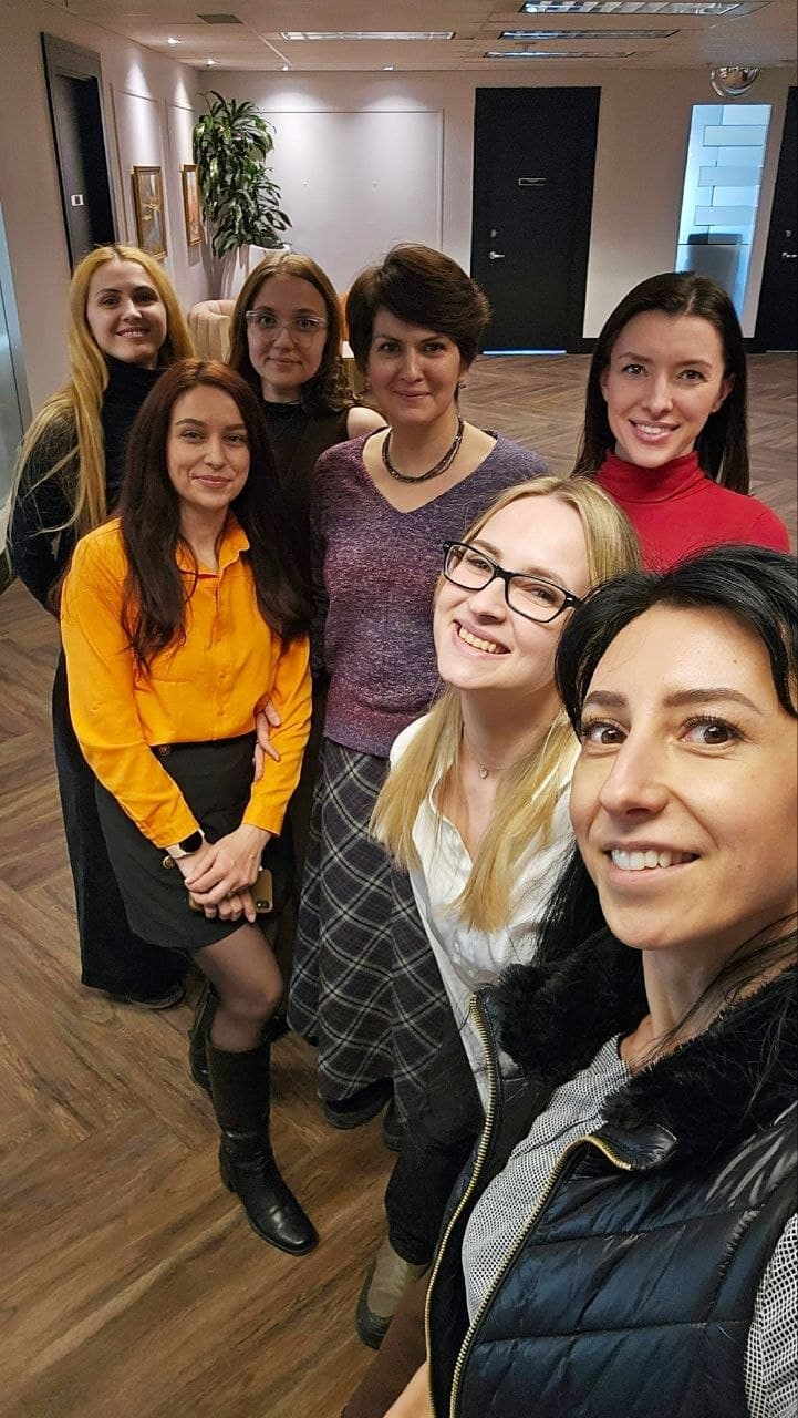 Olha Vozna with the Anytime Accounting team at the office