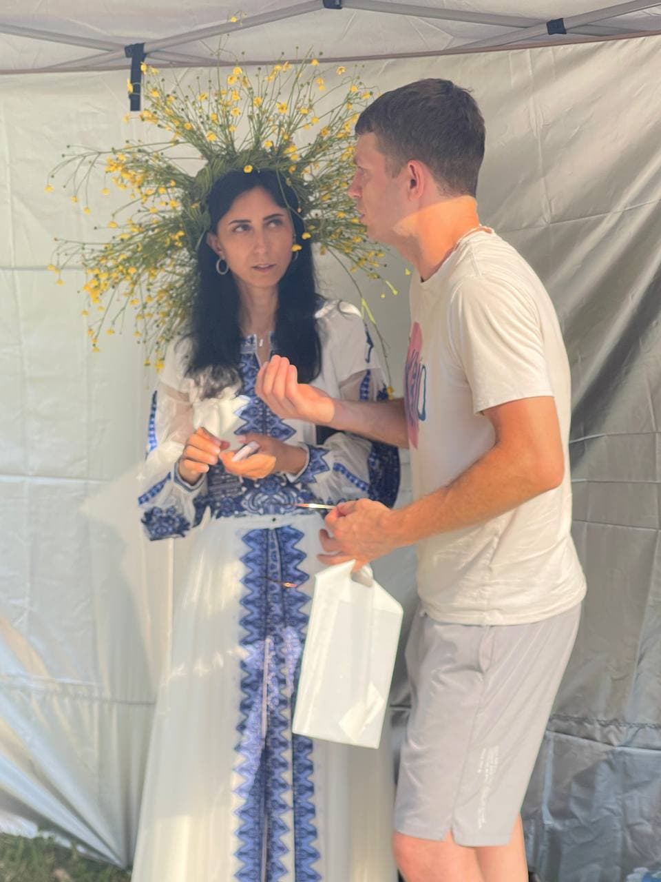 Olha Vozna speaking with a visitor at the festival
