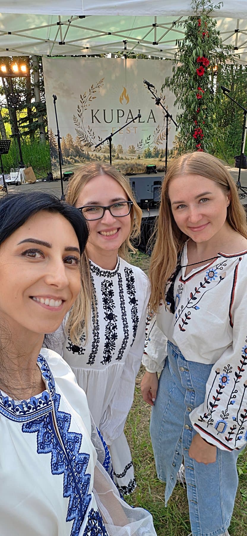 Olha Vozna with two festival guests in front of the Kupala Fest stage